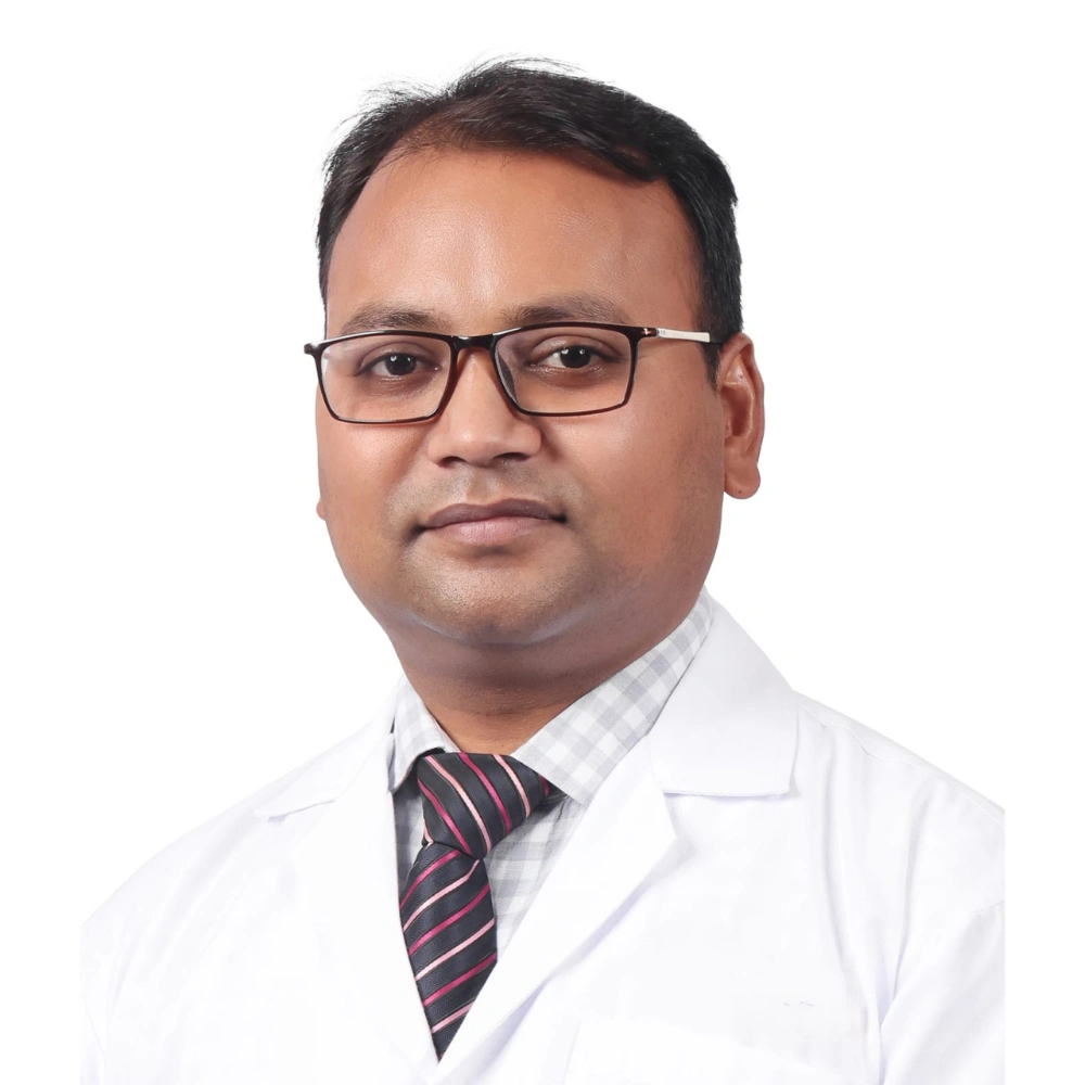 Official portrait of Dr. Ashish Malpani in a white coat